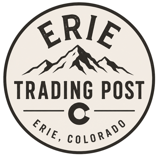 A circular vintage-style logo or sticker design reading “ERIE TRADING POST” with mountain graphics and “ERIE, COLORADO” at the bottom, shown on a plain white background.